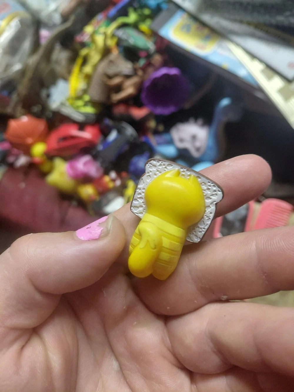 figurine is Loafy, a character from the collectible Hasbro Lost Kitties Series 1